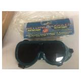 Welding goggles, 3 hole punch, extension cord,