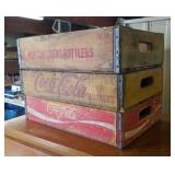 3 wooden soda crates, 2 are Coca-Cola