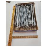 Flat of silver peg hook holders