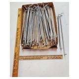 Flat of silver peg hook holders