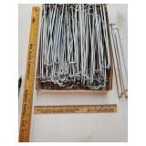 Flat of silver peg hook holders