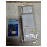 White shower curtain and hooks and package of