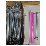 Approximately 30 peg hooks different sizes