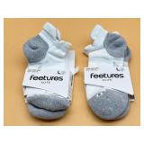Two pairs Feetures elite socks large