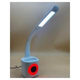 Desk lamp/clock with pen holder with many features