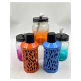 3 glass jar like tiki tourches and 2 metal like ti