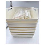 8 stackable storage bins off white , needs a bath