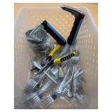 Plastic container with forks, tools, and sauce con