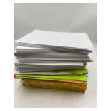 Reams of colored paper , roughly 5 reams of colore