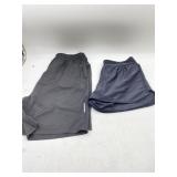 SIZE LARGE   2 pairs of black workout shorts , one