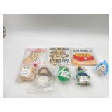 3 plastic signs with wooden bottoms and 5 differen