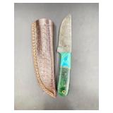 Damascus knife features a distinctive, water-like