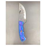 Damascus fishing knife features a distinctive, wat
