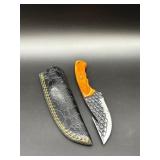 Damascus-style gut hook hunting knife with orange