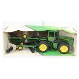 John Deere 4-Wheel-Drive tractor and disc