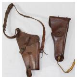 Lot containing 2 brown leather bolsters, one