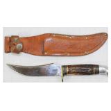 Western swept back 5" fixed blade knife being