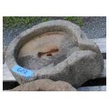 stone grinder cross carved on spout