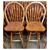 Pair of oak round back swivel bar stools