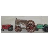 3 cast iron tractors, Red signed "ARCADE" driver