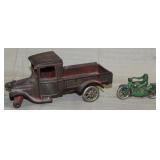 cast iron truck marked "ARCADE MFG CO" front
