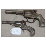 2 ornate iron cap guns, "SCOUT" Pat. June 17, 1880