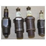 (4) spark plugs, (2) AC TITAN (1) AC, (1) unmarked