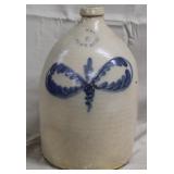 blue decorated stoneware 2 gal jug, signed