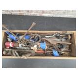Wooden box with antique planers, caulking guns,