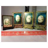 4 painted eggs in display cases