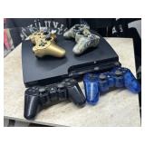 Playstation 3 Console and three controllers