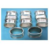 SET OF EIGHT SILVER PLATED NAPKIN RINGS