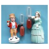 TWO FIGURAL EGG TIMERS