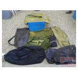 8 Military Duffel Bags in Plastic Tub. 8 Military Duffel Bags in Plastic Tub.