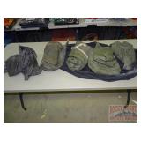 Asst. Military Rain Ponchos in Black Duffel Bag. Asst. Military Rain Ponchos in Black Duffel Bag.