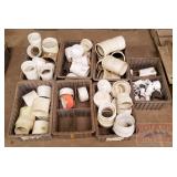 White PVC Fittings. 7 Containers.