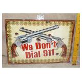 'We Don't Dial 911' Tin Sign. 12X17.