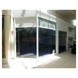 Glass store façade w/roll up door, 396 x 197