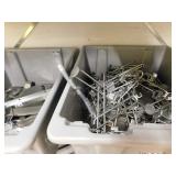 Assorted hangers and shelves in backroom area