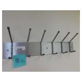 6 hooks could be used for brooms