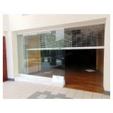Store façade with roll up door, 257x105 (22x9)