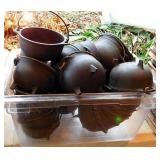 Plastic tub of cast iron pots