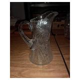 Glass pitcher. Has chip in it Glass pitcher. Has chip in it