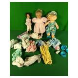 Dolls and assorted clothes Dolls and assorted clothes