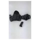 2 Holsters and 1 magazine 2 Holsters and 1 magazine