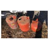 Three metal gas cans