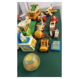 Box of Fisher-Price and other toys