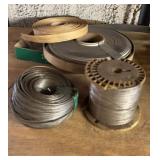 Rolls of Thin Wire and Rolled Foam Insulation
