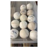 Thirteen Red Dot Softballs