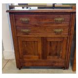 Wooden Commode Featuring Ornate Brass Hardware